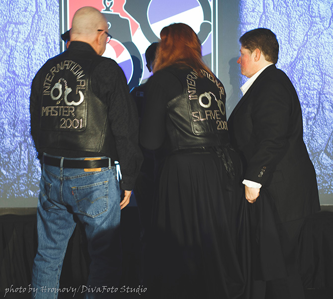Master Jim, Marsha and Cougar observing a logo hanging